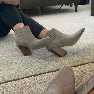 Gray suede booties with a western twist.
